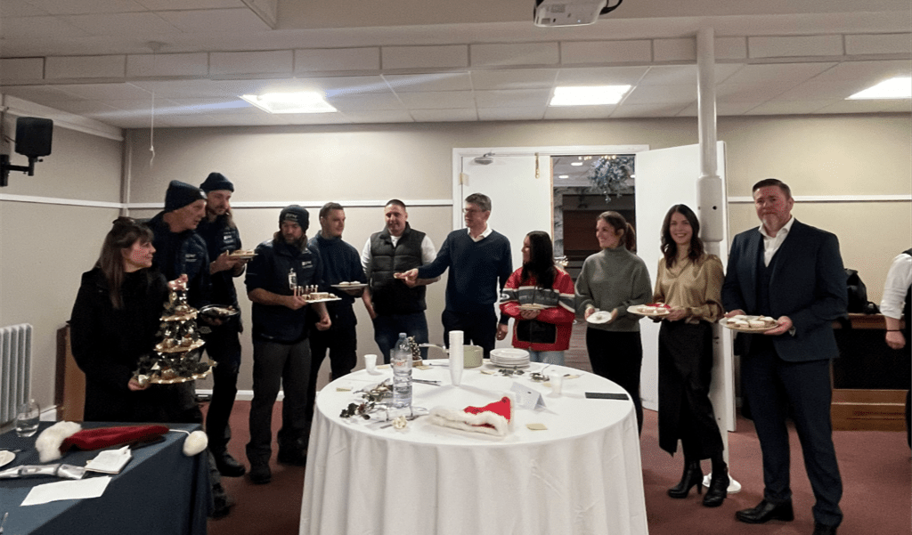 The Presence & Co. team in the mince pie competition, with MP Greg Clark